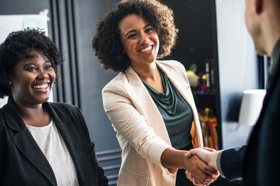 Business partners shaking hands in agreement